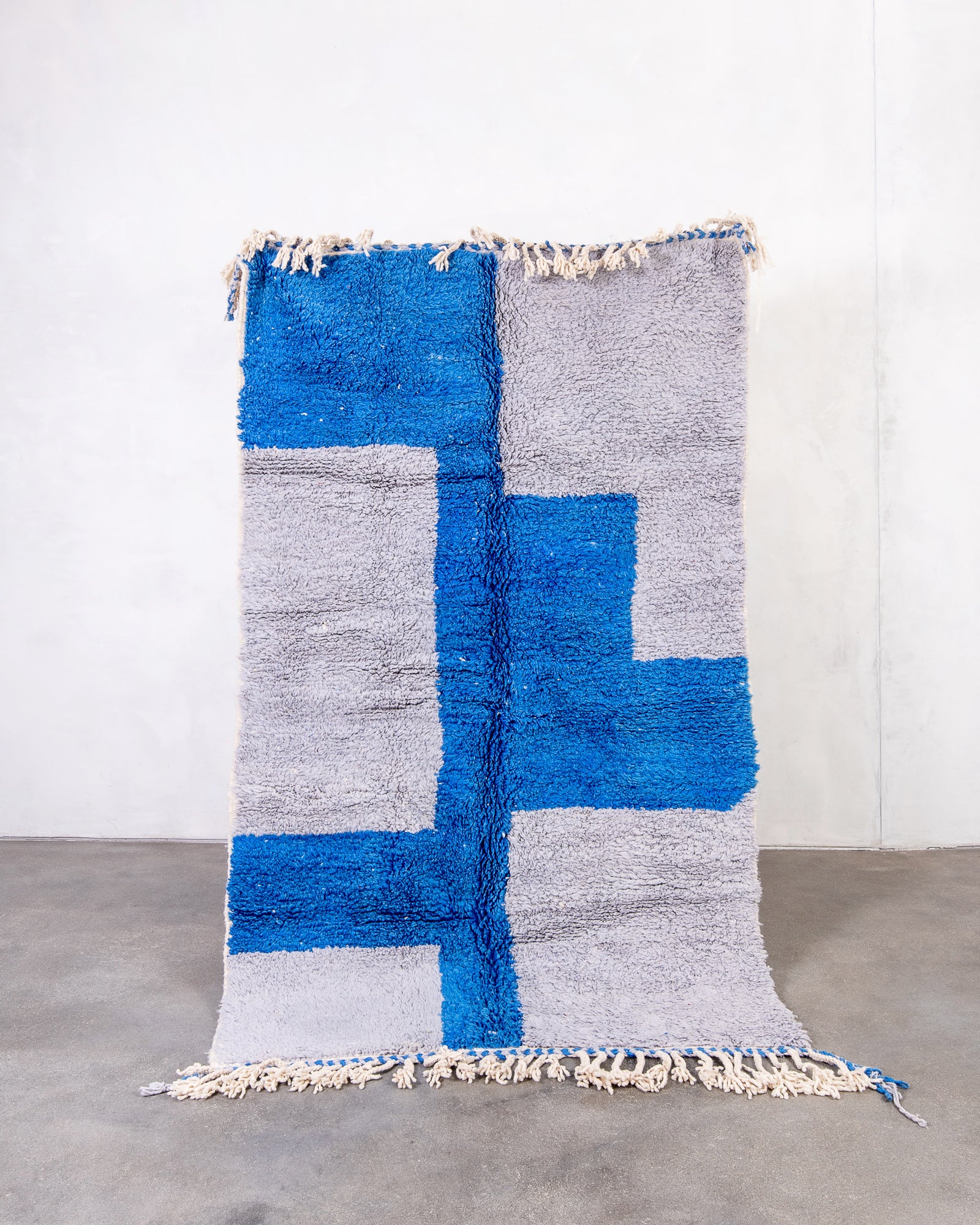 Modern, designer, handcrafted Berber rug from Morocco. Beniourain carpet with beautiful colours and patterns and fluffy wool texture.
